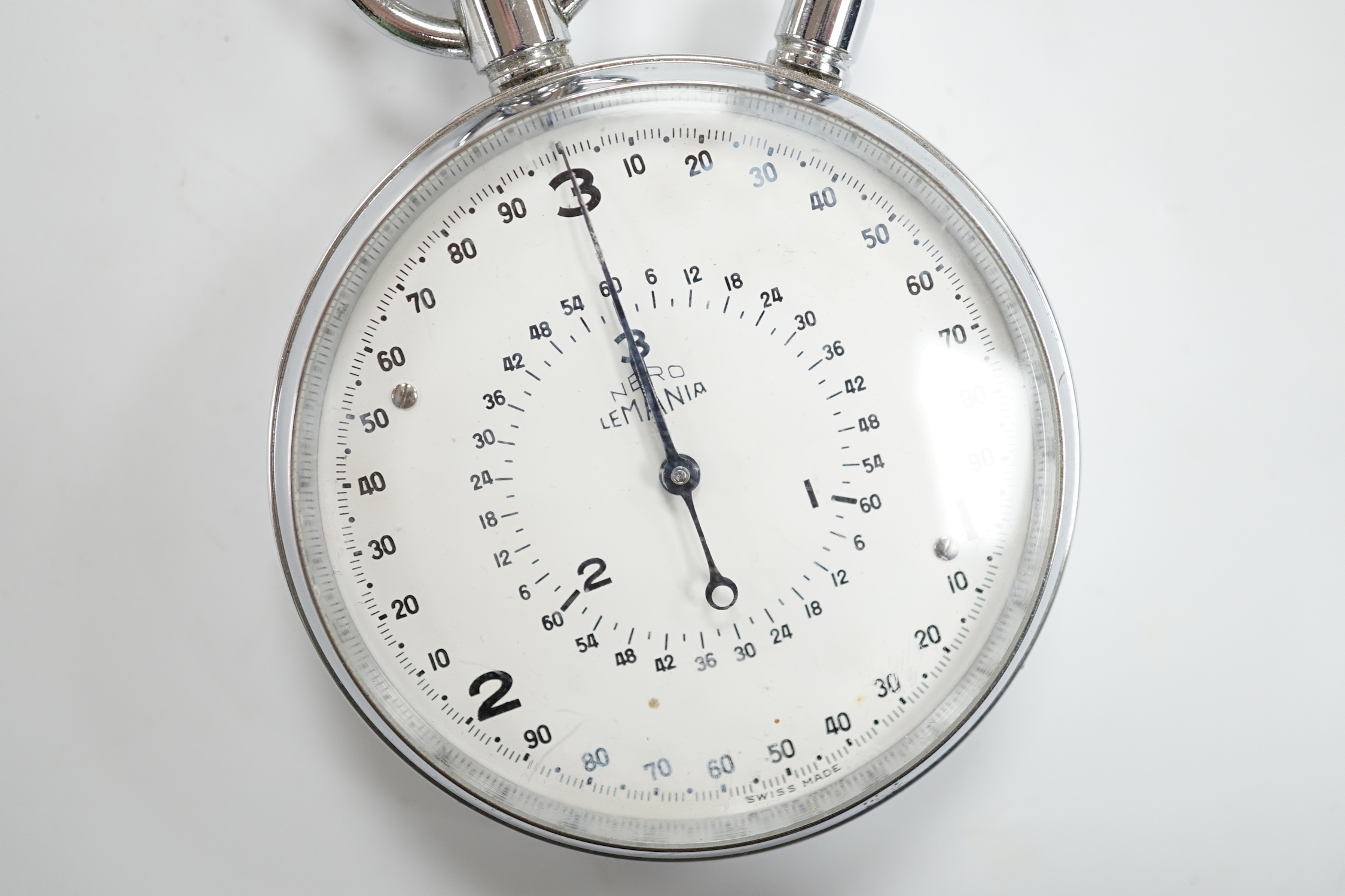 A chromium cased Lemania Nero stop watch, case diameter 62mm.